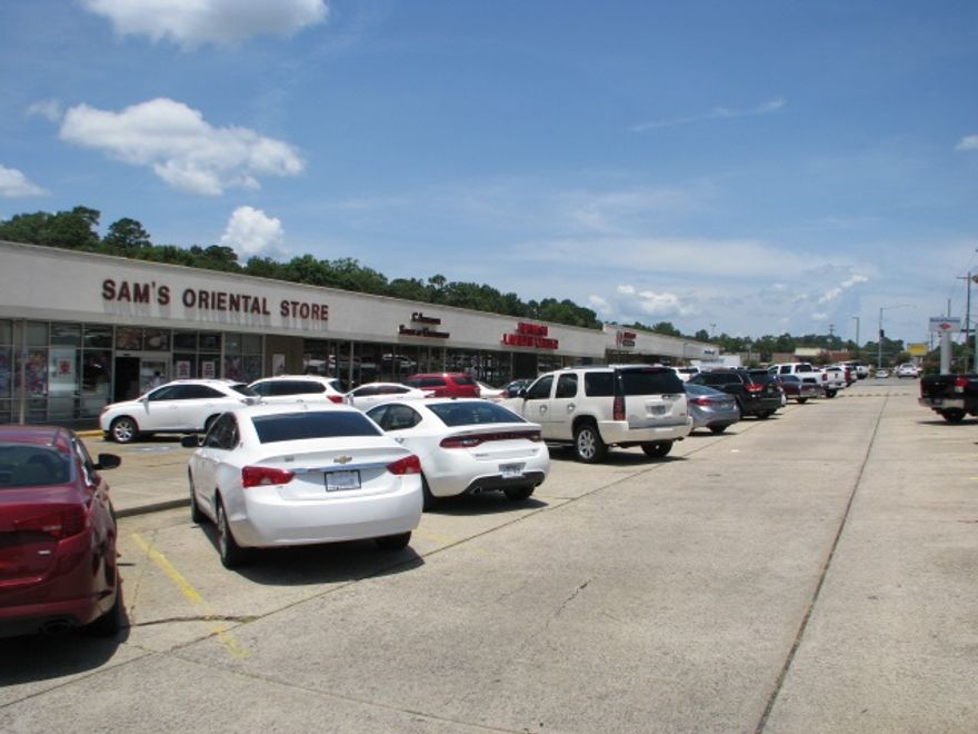 Retail strip center located immediately west across University Ave., from UALR.  The main entrance to the center shares a signalized intersection with the main entrance to the university campus.  The center contains 47,074 square ft & has 4.2 acres of land area.