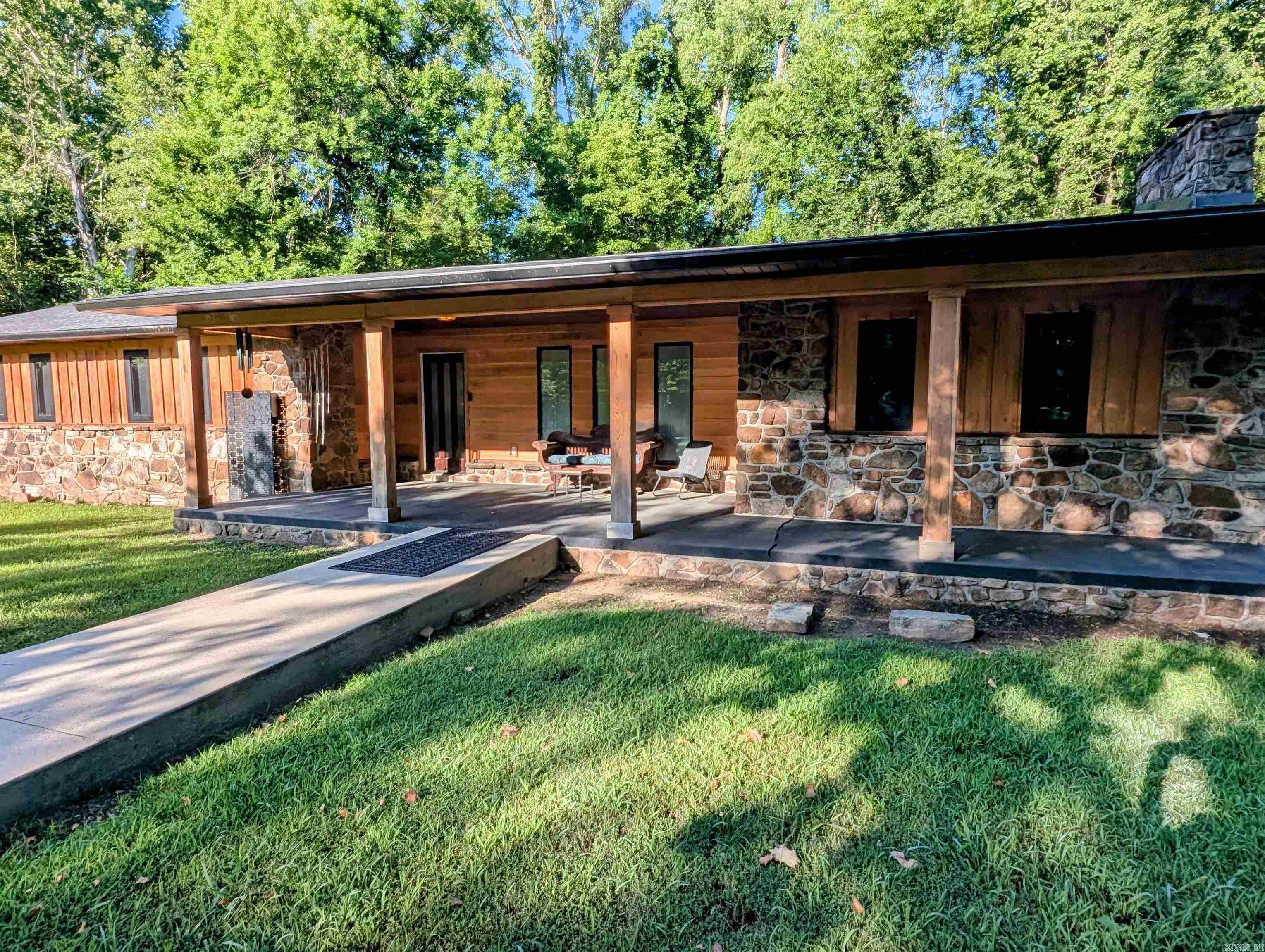 April Appraisal $405k w/o pool. Only resident on dead-end street and 2 blocks from historic court house, home is ultra private woodland creek enclave - with many locals unaware of its existence. Spa-like features not available elsewhere. ////CONTACT OFFICE FOR PDF with 8 video links for virtual tour and seller notes. ///// Full gut remodel 2024 - NEW improvements: roof (3/25), HVAC, cypress siding, gutters, all flooring (some heated), walls, wiring, high end windows, solar tube lights for daylight and ambient night lights, on demand instant hot water, reclaimed kitchen island, 3 ice maker types, wet bar, Italian cooktop, high capacity W&Ds, custom copper insulated bathtub made in India, heated swimming pool spa custom designed care-free, 2-3 person hot tub with neck / shoulder jets and finally picture windows and decking galore to re-situate the views towards the lively year round creek, field and woods. House NOT in FEMA flood zone. Separate driveway on Webb St begs for an ADU or subdivide. With 7/10/25 price cut = pool negotiable - not included; otherwise turnkey for STR or ready to move-in and bed down. Motivated home seller.