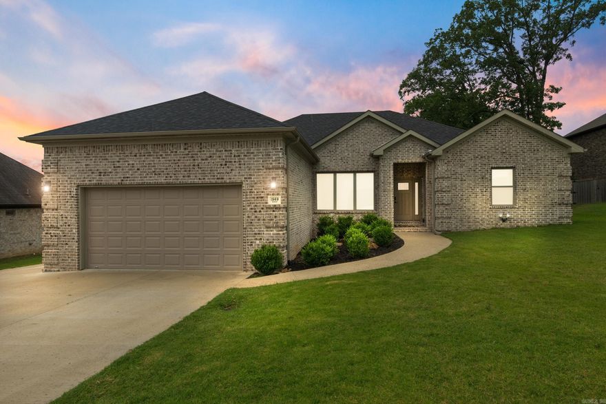 Welcome to 1569 Marquee Circle, located in the highly desirable Greystone community of Cabot! This beautifully designed 4-bedroom, 2.5 bath home offers a rare combination of style, function, and convenience, including a half bathroom, a feature not often found in homes in this area. Step into an open floor plan tailored for modern living. The gourmet kitchen is a chef’s dream, complete with granite countertops, stainless steel appliances, gas cooktop, large island, and a spacious butler’s pantry for extra storage and prep space. The oversized laundry room features a mud bench to keep daily life organized. The luxurious primary suite provides a true retreat with its expansive bedroom, spa-inspired bathroom featuring a soaking tub, separate tiled shower, double vanities, and a huge walk-in closet. Enjoy the outdoors from the covered back porch overlooking a fully fenced backyard, perfect for relaxing, entertaining, or letting pets roam. Additional highlights include LVP flooring throughout the main living areas, a two-car garage, side parking pad, and gutters. Seller is offering $6,500 toward buyer’s closing costs with an acceptable offer,making this dream home even more attainable.