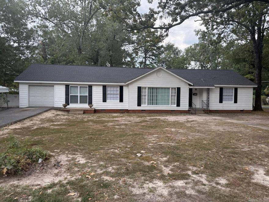 MOVE IN READY are the words of the day! You don’t need any paint or tools to move in, except to connect your personal washer and dryer. This home has all the finishing touches, new paint, nearly new tile flooring throughout, upgraded bathrooms, upgraded electrical and plumbing. Some of my personal favorites are, large open spacing to allow the family to spread out and have enough room to not be jumbled together, large kitchen for cooking and entertaining, and the deck, with the huge backyard and privacy six foot wooden fence, for family gatherings. There is a one car garage and a canopy covered area for additional parking. The curb appeal is wonderful and waiting for your personal touches. The home is centrally located to the main shopping areas of the city, medical care, the main expressway running through the city, banking and all that the downtown of the, City of Pine Bluff has to offer. Some of the offerings are, the new public library, the aquatic center and the newest downtown restaurants. Don’t miss this wonderful opportunity! Please call the listing agent or your chosen agent to schedule an appointment, as soon as possible!!