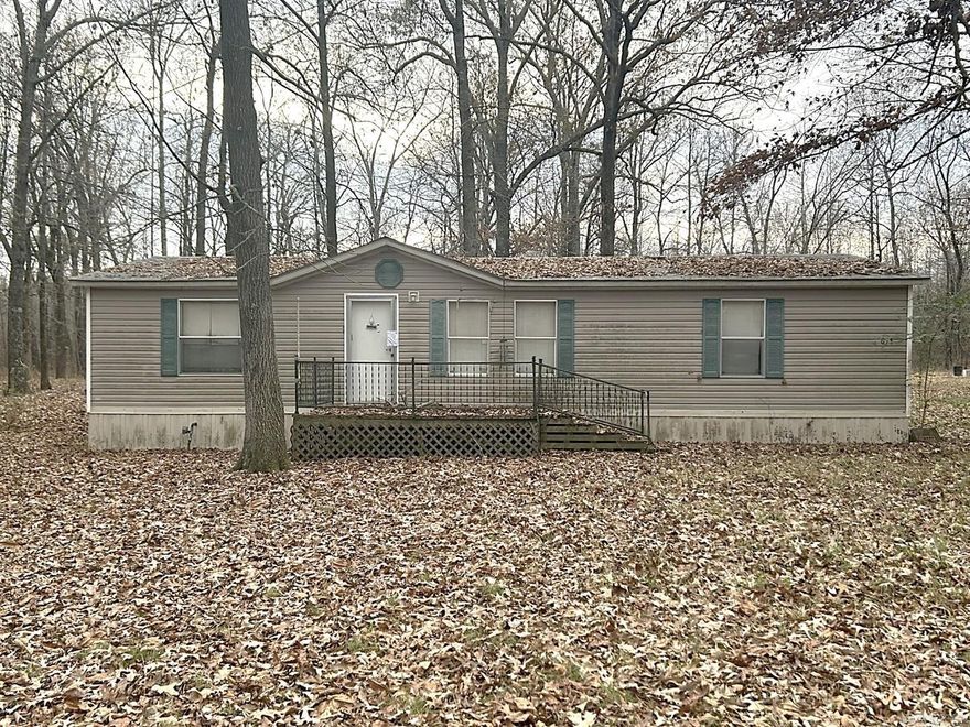 This property offers a functional layout with strong potential for buyers ready to update and personalize. Enter from the front door into the living room, which flows straight into the kitchen. Just off the kitchen, the laundry room leads to a back deck on the left. To the right of the entry are two additional rooms and a guest bath, while the primary suite is positioned to the left for added separation, with the water heater located in the primary closet. The home sits on approximately 1.55 acres, providing added space and flexibility. With a straightforward floor plan and convenient access to nearby services and major routes, this property presents an opportunity for thoughtful improvements.  Seller Pays: Buyer uses Premium Title Services, the seller’s preferred title partner and closing agent. This lets the buyer bypass the title insurance fee, related search costs and reduced escrow/settlement fees, since the seller will cover those charges. The average charges for title search and insurance is $1225 & escrow/settlement fees is $875, resulting in an overall savings of ~$1660 for buyers, who opt for Premium Title Services.