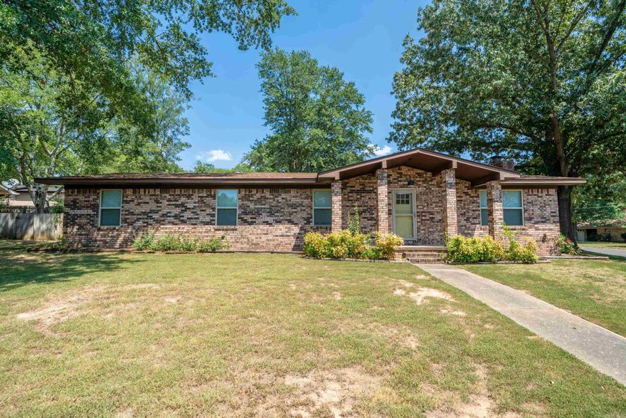 Completely updated and move-in ready! Great, quiet neighborhood just minutes from everything Hot Springs has to offer. Everything inside has been updated including paint, floors, lighting, granite counter tops throughout, HVAC and water heater. This is a great single-level home for a new family, someone looking to downsize, or a long-term investment opportunity. Has a two-car garage, outdoor storage shed, and an emergency storm shelter.  Plenty of room in the fenced backyard for pets, raised flower beds accompany the stone patio.