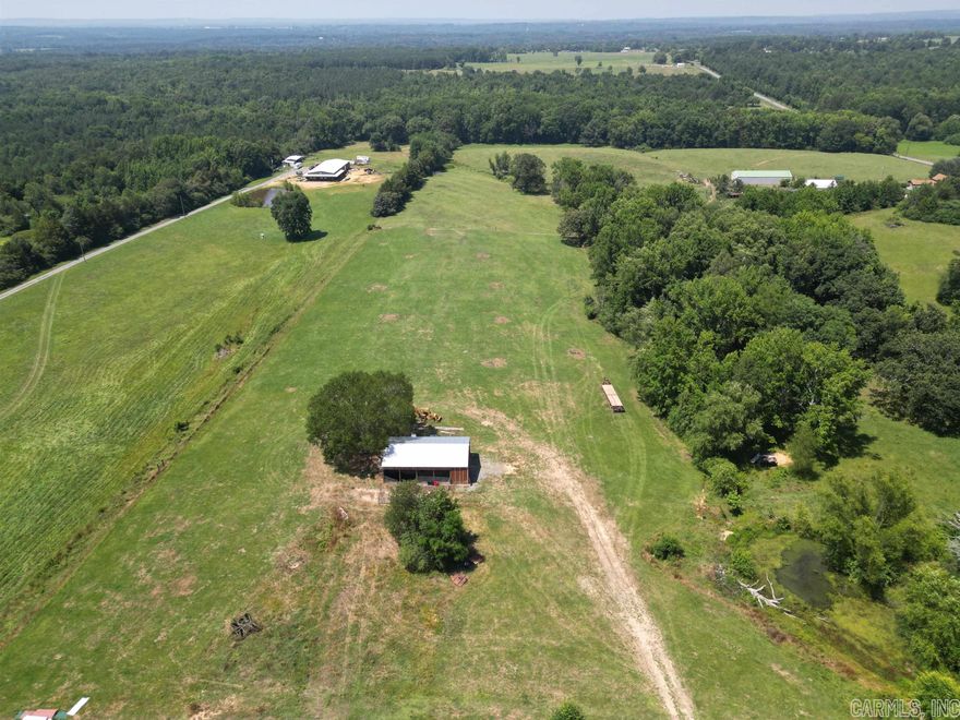 10 beautiful acres just 25 minutes north of Conway. This property boasts a pond, two wet weather branches, new barn, and plenty of space for your new home or livestock. Investors, this area is prime real estate for development!