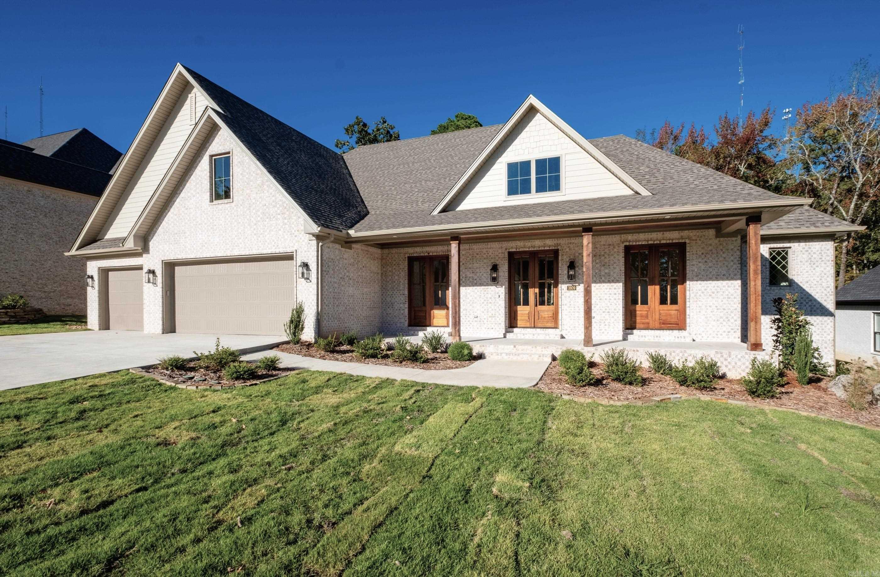 Newly constructed feature rich home backs up to the Bear Den Wild Life Preserve. The 4268 SF 4 bed/4.5 bath home is located on a level lot with 3 bedrooms on the main level. Office is directly off the main entry with 2 sets of French doors. The large primary suite offers spa-like bathroom, make-up vanity, full length mirror, soaker tub, walk-in shower, & linen closet. The adjoining closet has laundry room access providing extensive storage and wall mounted ironing board. The kitchen offers abundant cabinets, a large island with quartzite top, 6-burner gas stovetop, double oven, microwave, & walk-in pantry. The adjacent dining room has a built-in buffet with Tudor style glass doors & matching quartzite top. The gas log fireplace in the living room is trimmed in fluted tile and surrounded by built-ins. Upstairs find a bedroom, bath, craft room, lounge and large flex space. Outdoors provides an ideal place to entertain and enjoy nature on the private covered porch with fireplace. Three car garage, copious storage, high efficiency systems, hardwood floors through most of the home complete this traditionally styled residence. Enjoy miles of private walking/bike trails in Bear Den.