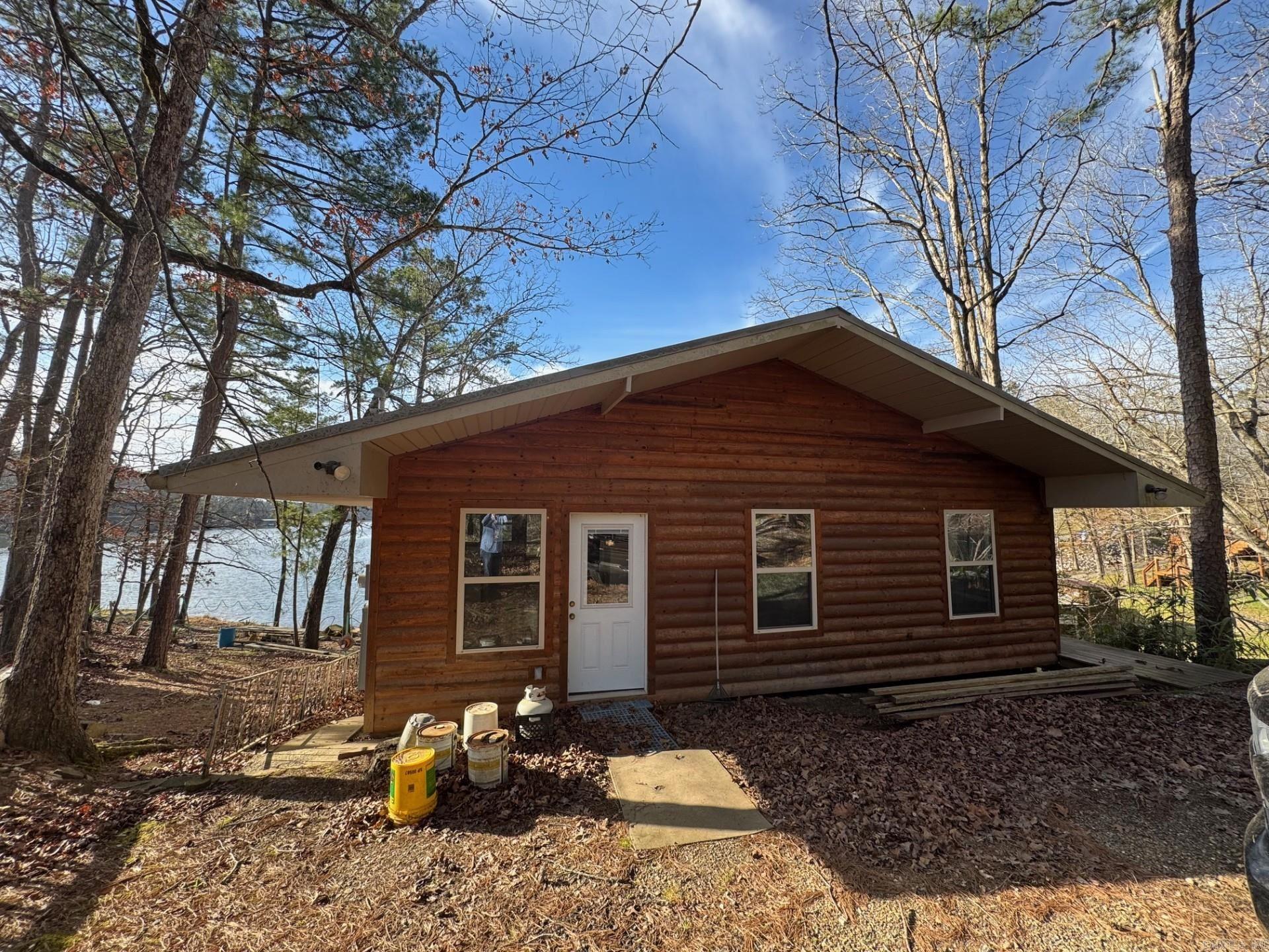 Are you looking for a cabin on the lake to make your own? or to have a money making airbnb? This is it! 1120 sqft cabin on the water, NEW roof in 2021, primary bedroom and bath added on in 2021. has boat house with two boats included. YES the boats and all furniture, ect.. Party barge, and bass boat. Cabin will be sold as is, everything stays. ALL for $225,000 !! Don't miss out on this opportunity to own a Lake house on Lake Norell, swimming, skiing, fishing. Great investment for rental or make it your own paradise. contact listing agent for more info or to make an offer today. Send highest and best offers. **** AGENTS SEE REMARKS*****