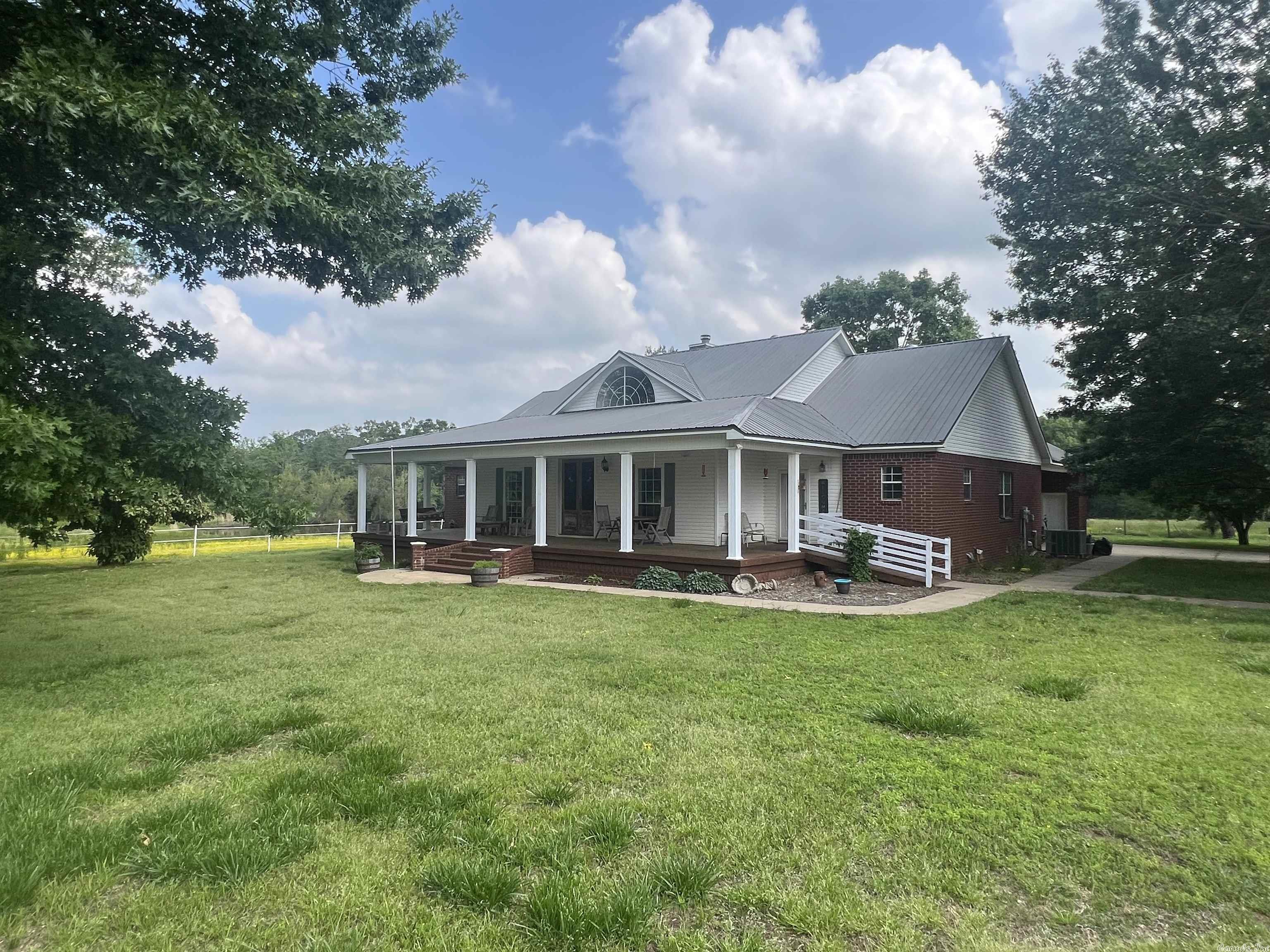 Horse and Livestock lovers! Look in here! This property is built to cater to any need a livestock enthusiast could have! Beautiful brick home phenomenally constructed with a breezeway, screened back porch, large comfortable front porch, all sitting on 25 acres of improved fenced and cross-fenced pasture! 4-stall horse barn with round pen and working facilities, loafing sheds, abundant grass, and water available in each paddock in the form of two ponds each stocked with bass and catfish! All of this within 10 minutes of Conway and modern conveniences in a quiet and serene setting, extemely desirable to those seeking refuge in a rural area known for hospitality and great neighbors. The property also boasts a nice parking shed with plenty of clearance and room for that boat, RV, or other valuables to be stored! More than enough acreage to support horses, cattle, and raising a family in a rural lifestyle! Don't miss this one! It won't last long!