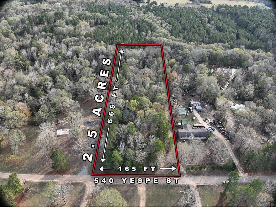 This 2.5-acre tract on Yespe Street gives you plenty of room. The land is wooded, level, and sits in a nice spot on the Arkansas side of Texarkana. Mobile homes are welcome, mobiles older than 5 years will need to be approved by the city.   You’ve got about 165 feet of road frontage and roughly 665 feet of depth, giving you privacy without being far from town. Utilities run along the road, plenty of room for a septic system in the back. This property has everything you need for a mobile home setup.