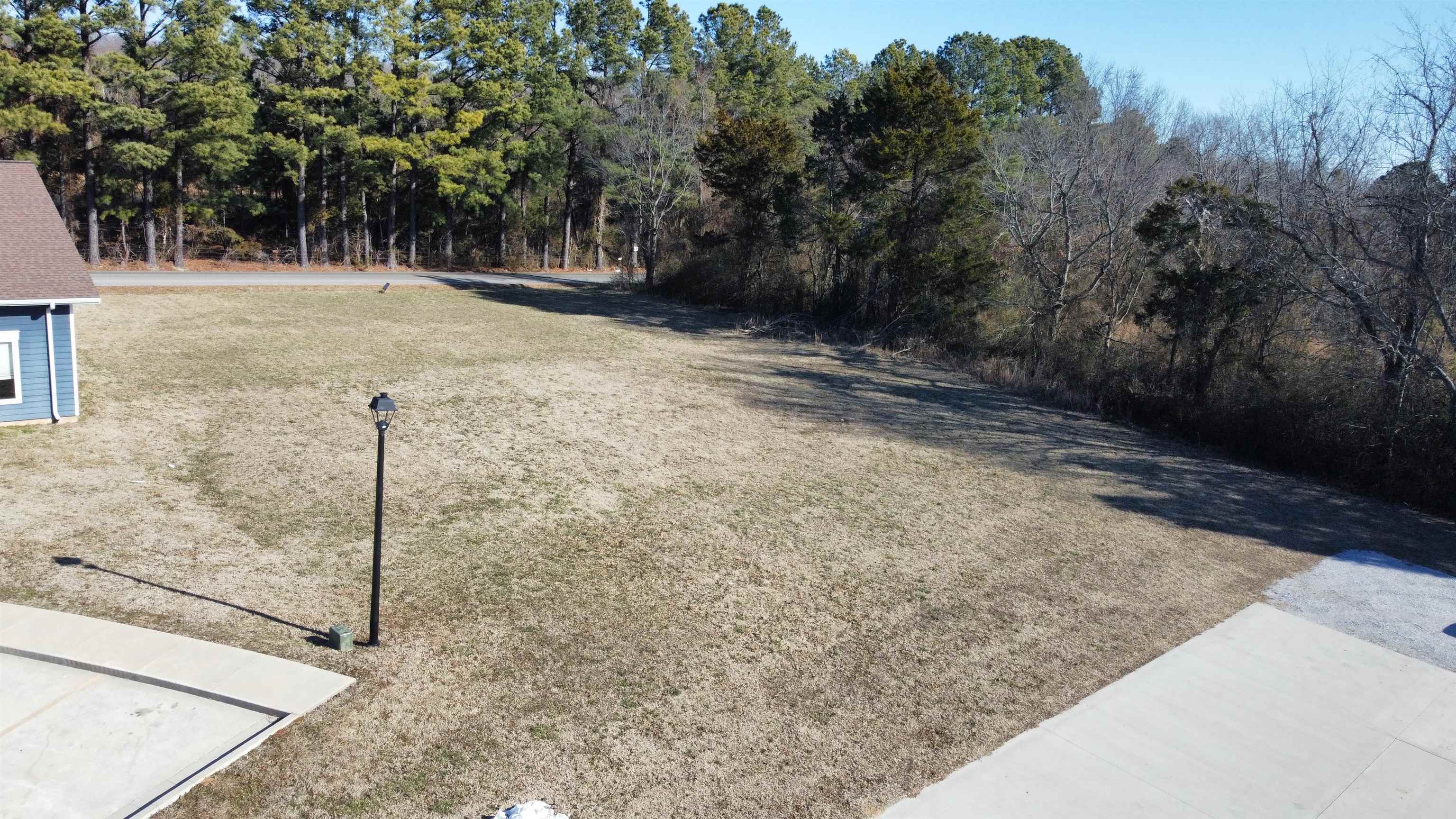 Great commercial lot with high visibility in a bustling commercial park!! There are three very well established businesses with lots of foot traffic and a built in customer base for your business. This lot has paved road access on 2 sides with one entrance being from Mountain View Eye Care on the south side and the road to Mountain View school running along the North side so no shortage of access on this one. All utilities are available on site to make the building process as easy as possible. Call today and lets go take a look!!