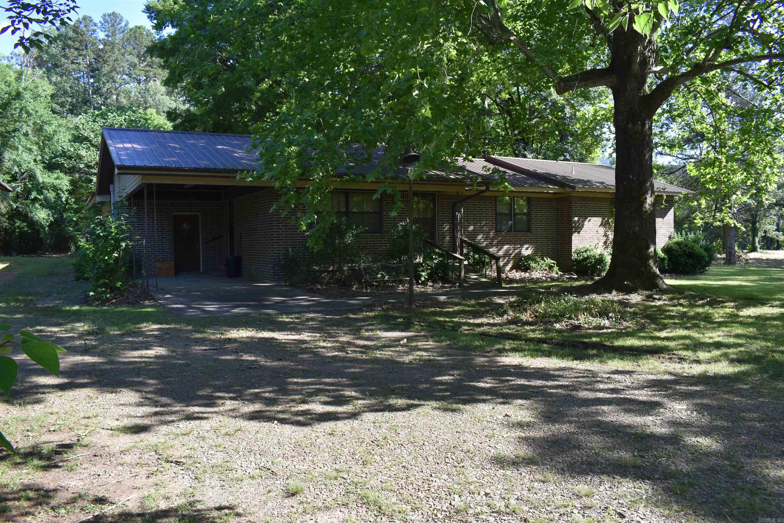 If you’re looking for the perfect slice of rural Arkansas to call home, you don’t want to miss this homestead. Located between Danville and Waldron along Highway 80, this brick home and acreage has something for everyone. The spacious home boasting over 2000 square feet sits nicely on 11 +/- acres, with a mixture of fenced pasture, timber, and Ouachita National Forest Boundary. • 2004 +/- Square foot brick home • Three bed Two Bath • 11 +/- Acres • Ouachita National Forest Boundary • RV Shed • Fenced Pasture • Fiberoptic internet • Power • Water well • Hardy Outside woodstove • Attached Carport • Huge Hardwood trees and great shade • Seasonal Creek • 1.5 Miles to Dutch Creek Access • Deer and Turkey Hunting • Highway 80 Frontage • 20 Minutes from Danville • 30 Minutes from Waldron