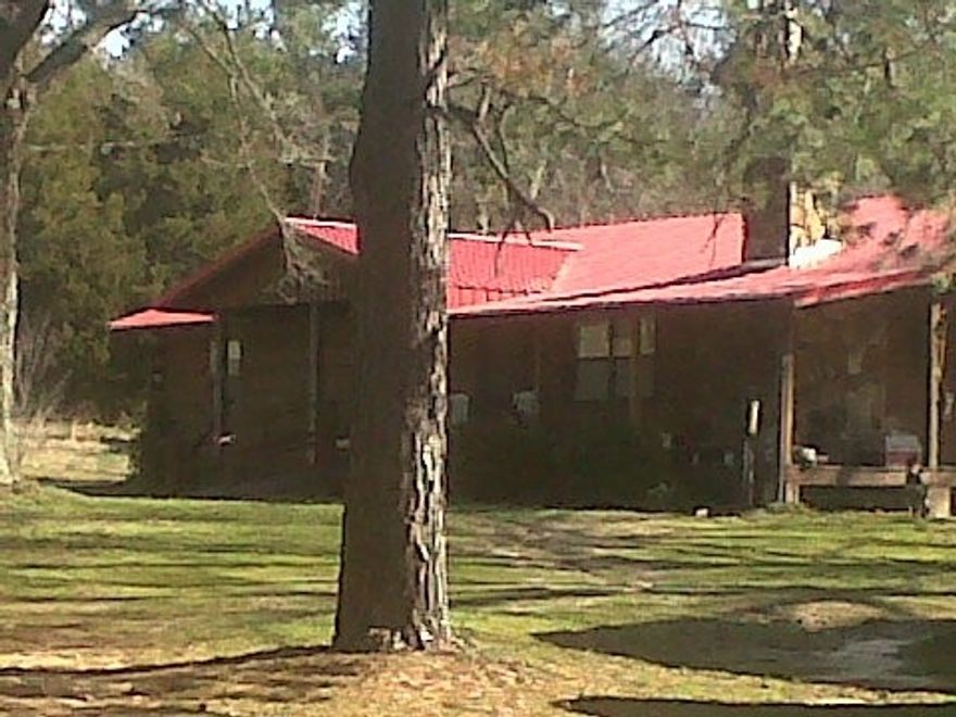 Lovely log home with open floor plan, open beam ceiling, nice partial wrap around deck.  3 bedrooms, 2 baths, CH&A plus beautiful fireplace with insert. You will love the nice yard and land that goes with this property.