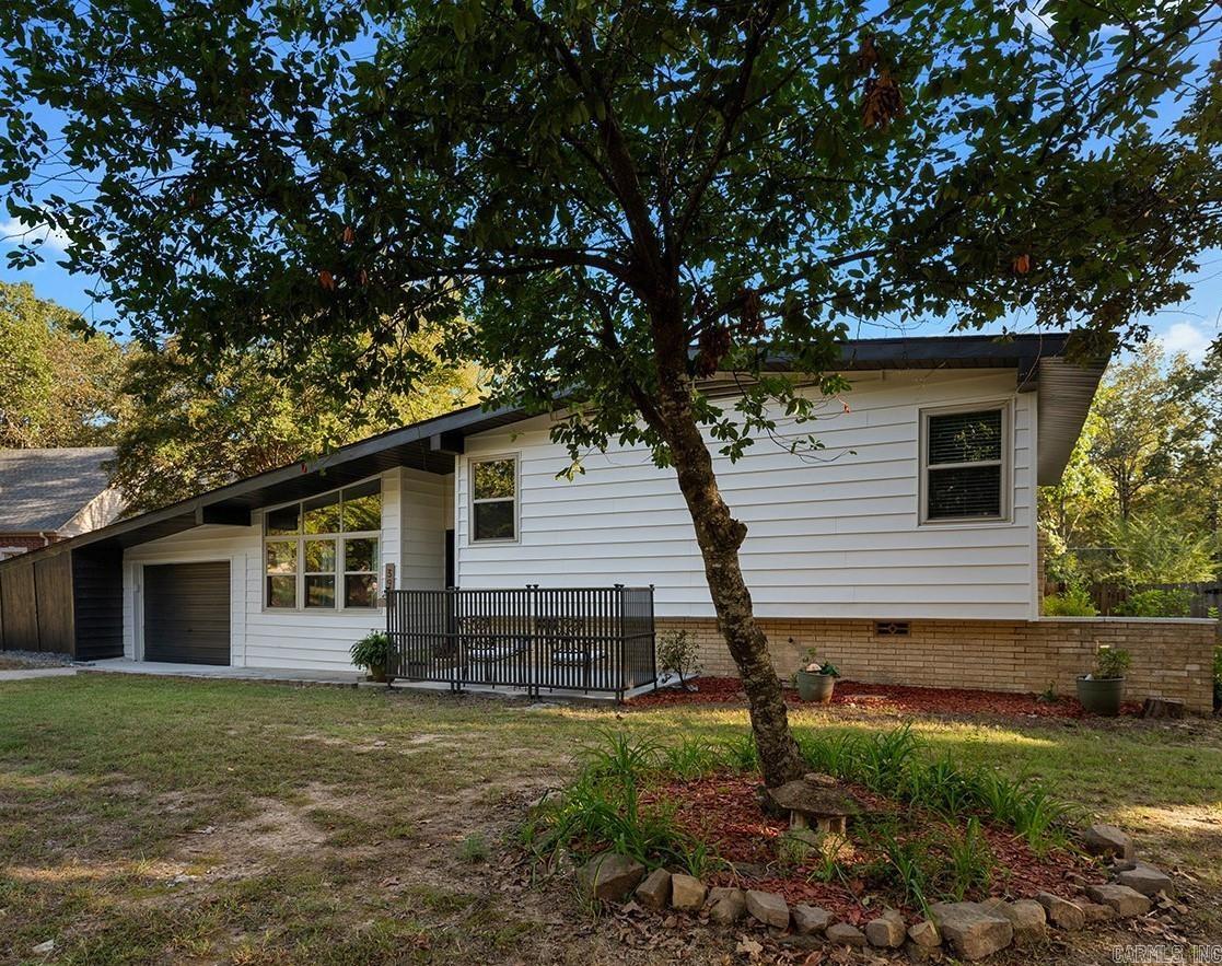 Make this renovated mid-century modern your dream home! Enjoy refinished hardwood floors and freshly painted interior and exterior. Entertain family and friends with your newer appliances, gas stove, newer kitchen soft close cabinets and quartz countertops. Updated windows and 2 full bathrooms, with new vanities and tile work. New lvp. plus two living areas, will give everyone in the family a place of their own. Tons of storage! Big fenced backyard with outdoor storage building. New roof 2025. Relax on your front patio or back porch! Close to area amenities, schools, and restaurants. Call ST today and schedule our your private showing. SEE AGENT REMARKS
