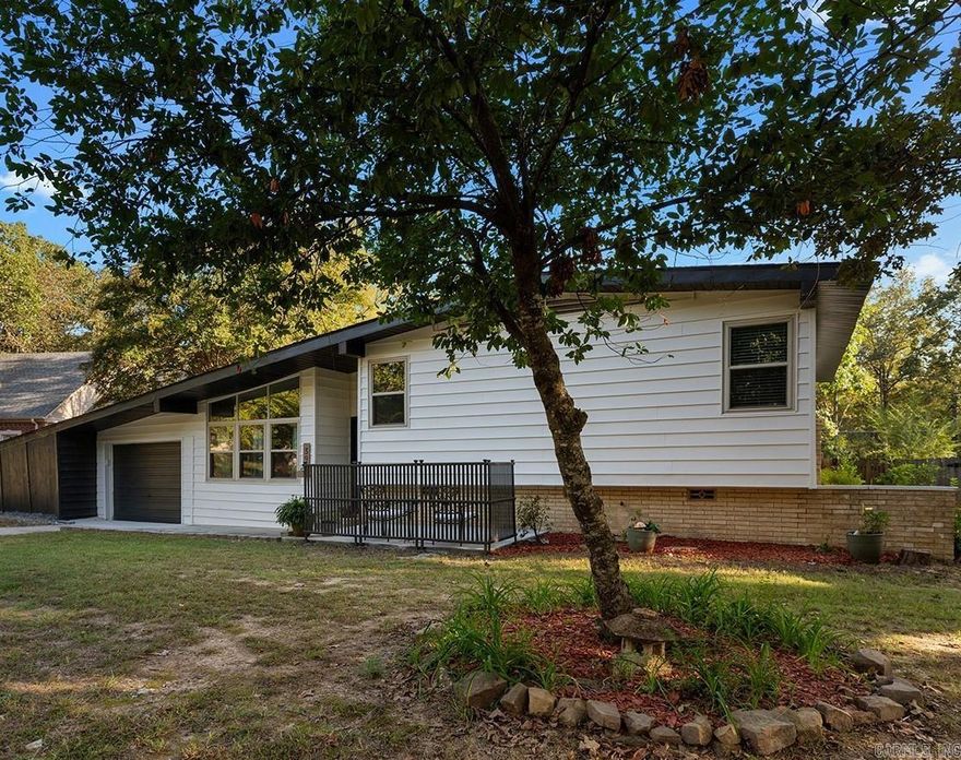 Make this renovated mid-century modern your dream home! Enjoy refinished hardwood floors and freshly painted interior and exterior. Entertain family and friends with your newer appliances, gas stove, newer kitchen soft close cabinets and quartz countertops. Updated windows and 2 full bathrooms, with new vanities and tile work. New lvp. plus  two living areas, will give everyone in the family a place of their own. Tons of storage! Big fenced backyard with outdoor storage building. New roof 2025. Relax on your front patio or back porch!  Close to area amenities, schools, and restaurants. Call ST today and schedule our your private showing. SEE AGENT REMARKS