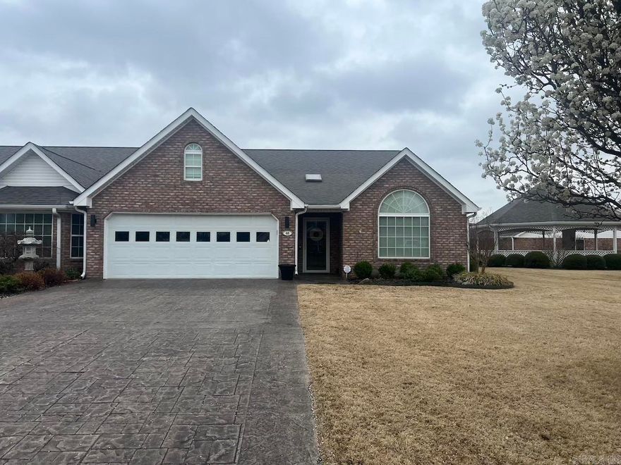 Gorgeous condo awaiting a new owner.  Roof is approx. 1-2 yrs old, water heater 2 yrs. old, HVAC 3 yrs old, new dishwasher, newly painted, electrical outlets have been replaced, gas fireplace, but the gas line isn't hooked up,  Vaulted ceilings in living room and dining area, large sunroom, hardwood floors, huge master bedroom with bay window and whirlpool tub and walk-in shower in master bath, large master closet, nice size laundry room with sink and a hookup for a toilet.  Guest bedroom has a double closet with large bay window.