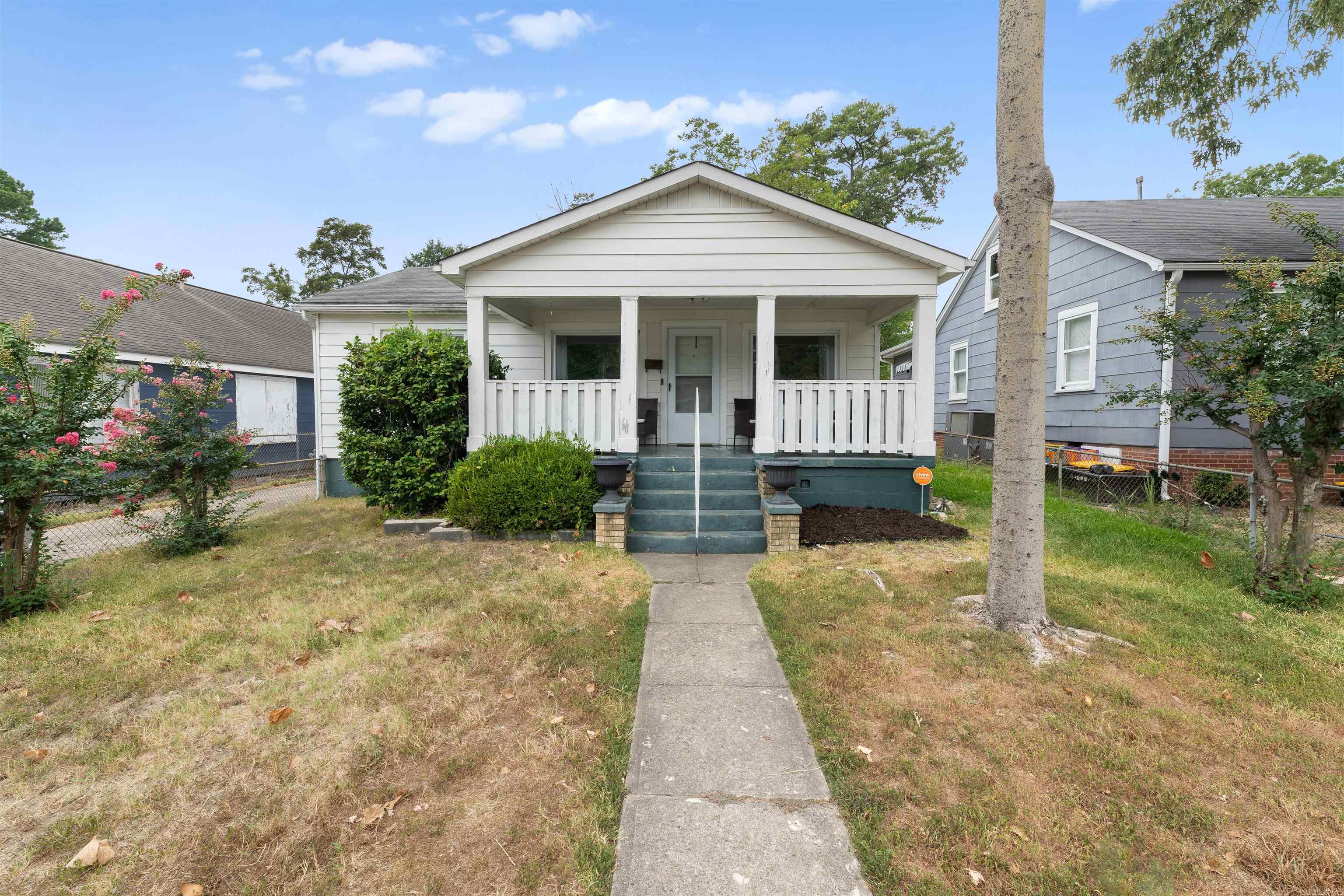 This home is ideally located within walking distance of UALR and close to medical centers and other city amenities, making it a convenient choice for anyone seeking easy access to work, school, or healthcare. Enjoy a cozy living room with a fireplace, a dining room with lots of natural light, and a spacious covered front porch perfect for relaxing. There are two bedrooms,1.5 baths, and a bonus room that could also be used as a bedroom. Newer windows, water heater, carpet, and light fixtures add peace of mind. A wonderful opportunity to own a home that blends charm and convenience.
