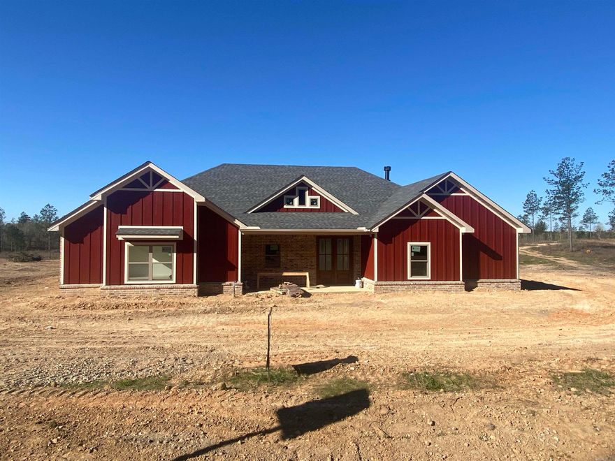 Nestled in the heart of Timber Wood subdivision on a beautiful 1.76 acre lot, this stunning new construction home is the epitome of modern living. With its thoughtful design and premium features, it's a dream come true! This 4 bed, 3 bath home is the perfect size for your comfort. Located in the highly regarded Bryant School District, this home is not just a place to live; it's a lifestyle upgrade. From the elegant design to the quality craftsmanship, every detail has been carefully considered. This open concept home features a chef's dream kitchen with high-end finishes & practicality. Soft close cabinets & quartz countertops are just a few of the features this kitchen offers. Primary suite features tray ceilings with stained wood inset. Primary ensuite bathroom with large tub & walk-in tile shower. Spacious primary walk-in closet that conveniently connects to the laundry room. Enjoy the tranquility of the outdoors from your private retreat; backing up to green space where you can embrace the beauty of nature in your backyard from your covered porch. Don't miss your chance to make this house your home. Schedule a viewing now & step into the future of comfortable, luxurious living