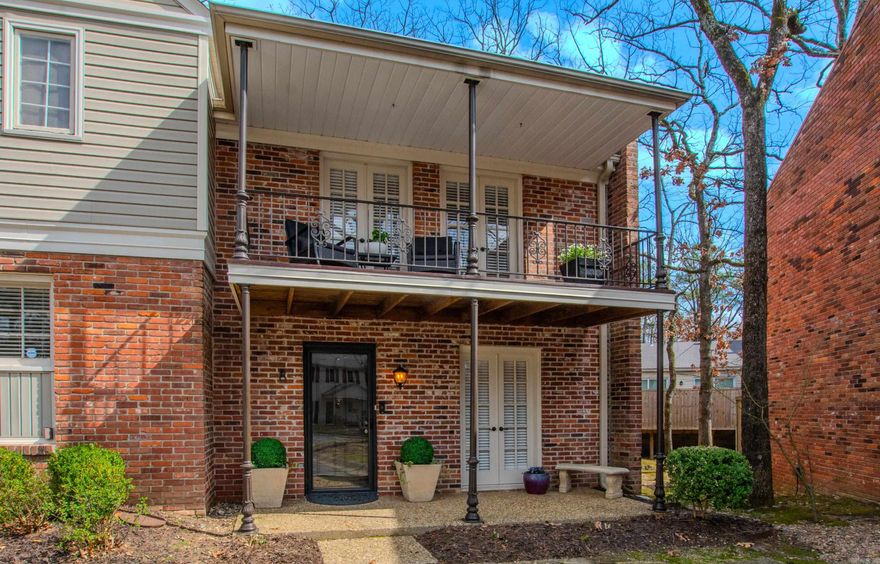 Inviting New Orleans style two-bedroom, one-and-a-half-bath Condo features durable LVP flooring and cozy carpeted bedrooms. Each bedroom opens onto a covered balcony—an ideal spot to enjoy your morning coffee or unwind at sunset. The updated kitchen features granite countertops.  The dining area opens into a spacious great room with a fireplace, creating a great flow for everyday living and entertaining. From the great room, step out to a fully fenced patio that includes a large storage closet for added convenience.  Refrigerator, washer, and dryer all convey with this beautiful condo.  Community amenities include a clubhouse, tennis courts, and a refreshing pool. Centrally located near restaurants, coffee shops and grocery stores, this condo pairs comfort with everyday convenience.