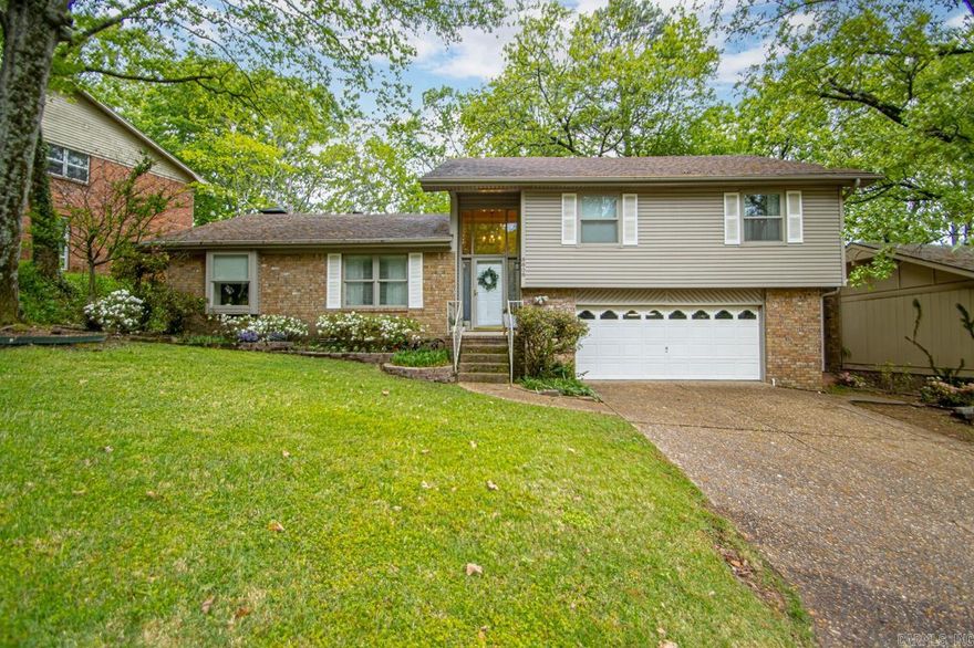 A wonderful opportunity to own a beautiful home in Leawood!  The lake is literally at the end of the street and perfect to walk around and feed the ducks.  This home has lots of space with two living areas.  There is a large stone wood burning fireplace.  There is access from the kitchen to an amazing deck and backyard to play and entertain.  The HVAC was replaced in 2012.  The roof, gutters and Living room hardwoods in 2014.  The kitchen floor and HWH was done in 2018.