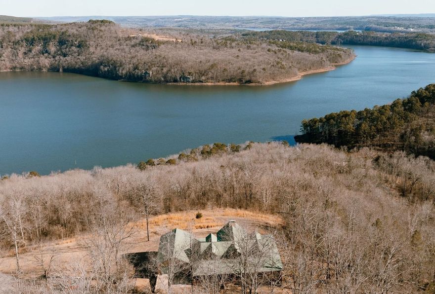 LAKEVIEW HOME with 2 BOAT SLIPS!!!  This lovely 2002 log home is completely furnished and ready to enjoy!  Lakeviews from almost every room in the house, dock is just a 3-minuite cart ride down to the lake, master on the main level, 2 large living areas in the main house and a 3rd living area off of the garage!  A very private setting at the end of a cul-de-sac, 2 large lots totalling approximately 2.3 acres.  7 x 12 safe room, 2-car garage on main level and 2-single car garages on basement level.  The community Boat Dock has solar power for lifts!  A wonderful property in a fantastic location!