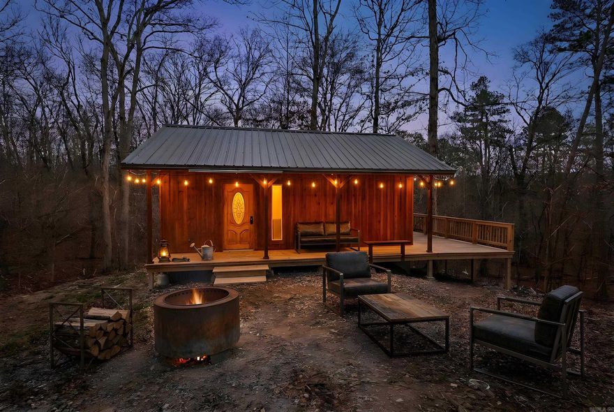 Situated on 2.75+/- acres, this fully finished 16x26 cabin offers a great combination of space and convenience. Enjoy the 104 sq ft open front porch and the 200 sq ft deck, perfect for taking in the natural surroundings. The property is serviced by city water and features 200 amp underground electrical service, providing excellent potential for future expansion.  A hiking trail leads directly to adjoining Corps of Engineers land, with Twin Creek running through it. The property borders Corps of Engineers land on one side.  Located approximately 3.6 miles from the Twin Creeks boat ramp and recreation area campground, this property provides convenient access to boating, fishing, and other outdoor activities. Completely finished and ready to enjoy, this cabin is suitable as a weekend retreat, investment opportunity, or full-time residence.