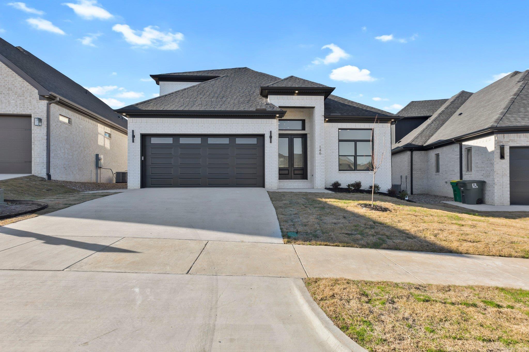 This thoughtfully designed, move-in ready, brand new build has it all! Tucked away in the sought after Fletcher Valley neighborhood, this 2 story stunner features an all brick exterior, and the open floor plan still provides dedicated living spaces. The entry is truly grand with custom design elements, gorgeous lighting, and tall ceilings. This pinterest-worthy kitchen features cabinetry galore, high end appliances, a walk-in pantry, and the massive fridge is there for you! You won't want to leave the primary suite as it floods with morning sunlight. The primary bathroom is a true oasis, with floor to ceiling tile, a freestanding tub, and a spacious walk in closet. Upstairs you will find two more bedrooms, and the attic is accessible through the bonus area. The back patio is the place to be though, covered with its own fireplace, you'll want to stay curled up all evening. With massive sliding glass doors leading from the open kitchen to the patio, there isn't a better place to spend your time. With a community pool and park coming soon, Fletcher Valley is a must-see!