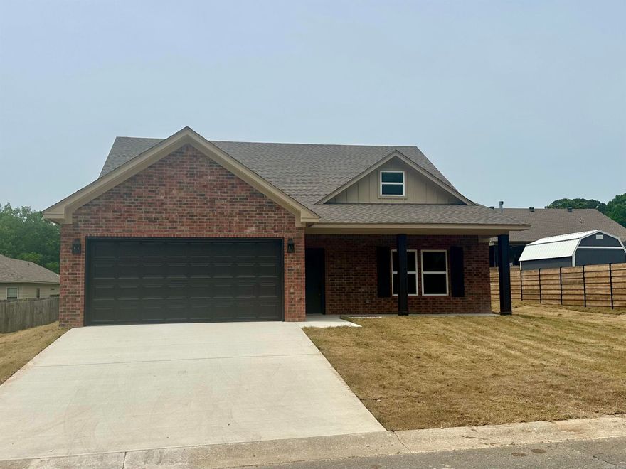 This new construction is perfect for you! It's move-in ready and located in the Lake Hamilton School District. The subdivision is close to the school, which is super convenient. Inside, you'll find vinyl plank flooring and beautiful granite countertops in the kitchen and bathrooms. The soft close drawers and cabinets add a touch of luxury. The primary bath even has his and hers closets! Outside, there's a covered back porch and all new sodded lawn (just put down). Plus, the community offers a pool and a basketball court for you to enjoy.And don't forget, there's a 1-year builder's warranty for peace of mind. It's a dream home!