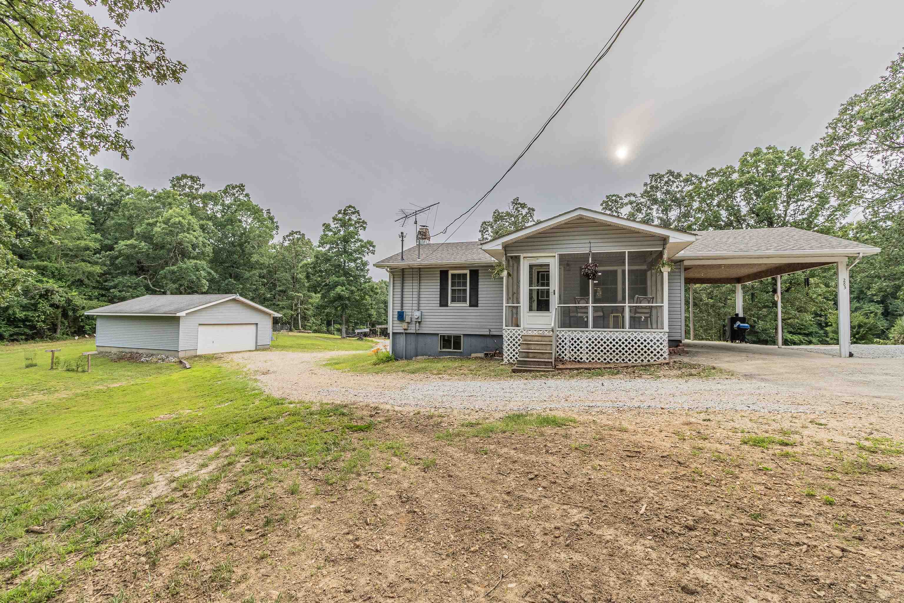 This move-in ready 2 bed, 2 bath home is the perfect setup for anyone looking to start their homesteading journey. Inside, it features a brand new roof and new kitchen appliances, with a walkout basement that includes a kitchenette, bar, wood-burning stove, and a Murphy bed—ideal for guests or a secondary living space. Sitting on 8 acres, the property is cross-fenced with multiple paddocks for managing livestock and includes a barn with two lean-tos, stalls, a tack room, feed room, and chicken coop. There's also a separate chicken coop, raised garden beds, and a shop with electricity for all your tools and projects. Outdoors enthusiasts will love the one-room cabin nestled at the back of the property, perfect for weekend retreats or hunting. Three ponds—two of which are stocked—offer great fishing opportunities, and many of the structures were handcrafted using cedar harvested directly from the land. Whether you're dreaming of farm life, self-sustainability, or just a peaceful place to call home, this property is ready and waiting.
