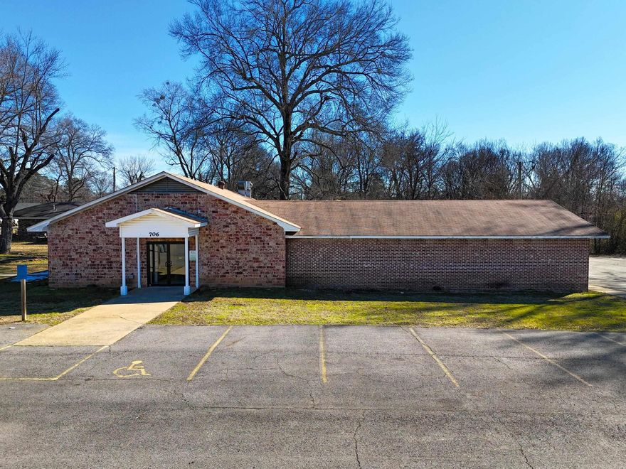 rime commercial opportunity located just minutes from University of the Ozarks! This versatile property, previously utilized as a church, offers multiple office spaces, spacious gathering areas, and a functional kitchen setup. With over 30 on-site parking spaces, accessibility and convenience are a major advantage for staff, clients, or event attendees. Ideal for professional offices, educational facilities, nonprofit organizations, community use, or redevelopment. The flexible layout allows for a variety of business ventures, all in a high-demand location with strong visibility and growth potential.