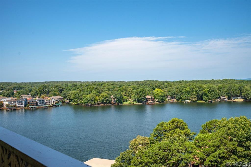 Amazing views from this affordable Lake Hamilton condo. It is very clean, completely furnished, and ready for a new owner to enjoy. The private balcony, easy access ( elevator right across from the door), covered parking, large beautiful pool, spacious landscaped grounds, fitness room, pool table, tennis/pickleball courts, and outdoor grills add to the value here. The location is convenient to all of Hot Springs. Nightly rentals are allowed for potential extra income.