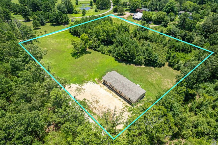 Charming 2021 Mobile Home on 3 acres - Close to Lake Hamilton School. Experience serene living in this home perfectly situated on 3 private acres.  Enjoy the peace and privacy of country living while still being close to essential amenities and educational facilities.  Don't miss out on this unique opportunity, to own a 4 bedroom, 3 bath home. Added feature includes  a 12x18 storage building and a new 5 person storm shelter.