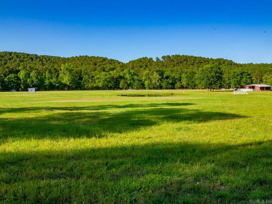 Beautiful flat 5 acres, that's been cleared and fenced for pasture land.  It was built for horses!  Includes a small pond and a covered shed for the horses to escape from weather.  Water mitigation was completed as well to prevent standing water.