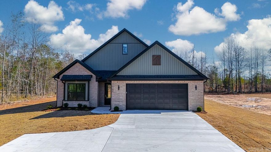 If you’ve been dreaming of having some space while being close to town, this one checks all the boxes. Sitting on just under 4 private acres in the Bryant School District, this new construction home blends classic charm with a fresh style you’ll love. Inside, the open layout feels bright and welcoming with its green accents, gold fixtures, custom cabinetry, gorgeous countertops, and walk-in pantry. The living room centers around a cozy wood-burning fireplace, and a spacious laundry room making everyday life a little easier. You’ll find three roomy bedrooms plus a front office with a full closet—so it can easily double as a fourth bedroom if you need it. The primary suite is comfortable and relaxing, and there’s plenty of storage throughout. Step outside to a covered patio overlooking your very own private oasis. It’s peaceful, quiet, and the perfect blend of “country feel” while still being just minutes from town. This one is a must-see! See agent remarks.