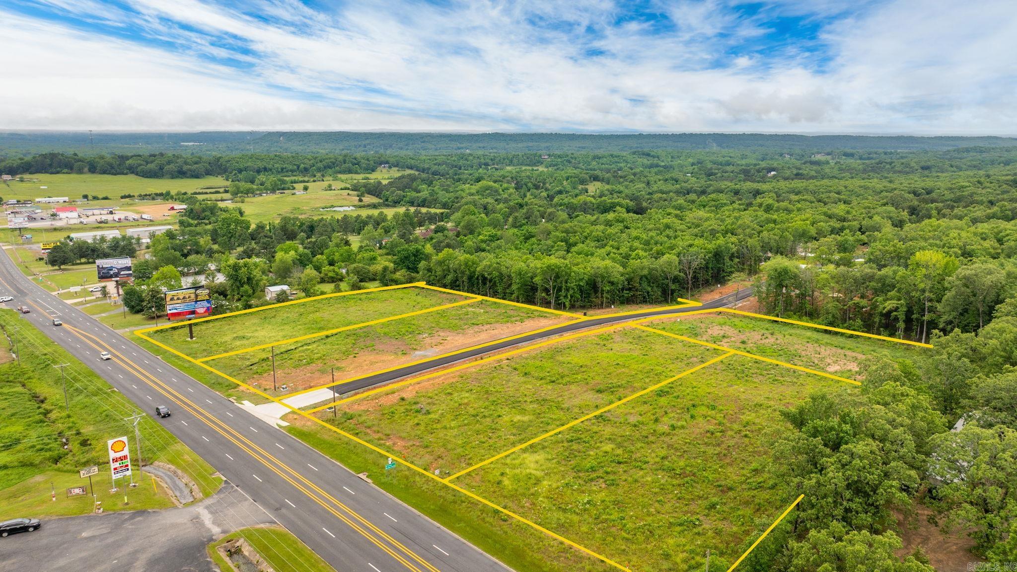 High Visibility location on Hwy 65 with a high traffic count. One acre parcels available that could be combined for up to 3 acres together. 6 acres total commercial land available. Sky Eagle Drive divides the two 3 acre parcels. Outside of the city limits with no restrictions. Property is cleared and ready to build