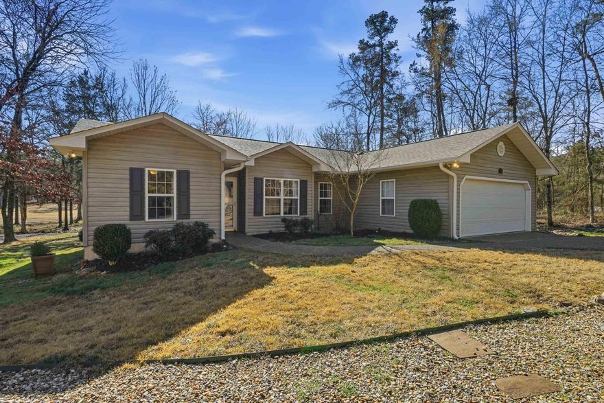 Golf-front living in Hot Springs Village! A must see 3-bedroom, 2-bath home with  beautiful views of the golf course from the back deck—a great backdrop for everyday living or a getaway. Enjoy the outdoors from the deck or from your four seasons sunroom. Inside, you’ll find a practical layout with a kitchen/dining/living combo, and all bedrooms on the same level and lots of updates.