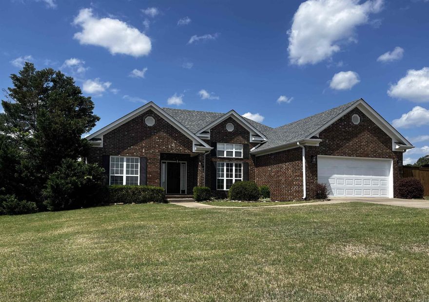 Ready to move into!  This home is a must-see.  It is clean from inside to out. Interior entirely repainted, new floor throughout large open floor plan.  Split bedroom plan.  12' ceilings. This home has a gas fireplace with underground lines to storage tank below ground.  Enhanced security system, newer HVAC, high speed internet service. Home has tons of storage with walk-in closet in primary bedroom.  Primary bath features jetted tub.  Laundry room has built-ins and sink.  Large back yard with storage building, covered patio, and privacy fence.  Refrigerator, washer, and dryer to convey!  Agents - see remarks.