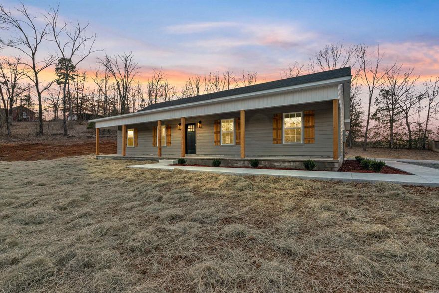 This home is for those that love porches! It has a generous front and back porch overlooking a large yard on an acre. It is located in a quiet neighborhood in Greenbrier.  Nice, vaulted ceiling in the living room. Kitchen has painted cabinets with granite countertops, a stylish vent hood and a pantry. The guest bedrooms are separate from the primary bedroom. Primary bathroom has a custom tile shower and will have a glass shower door. The bathrooms also have granite countertops. The floors are stained concrete which makes them indestructible.