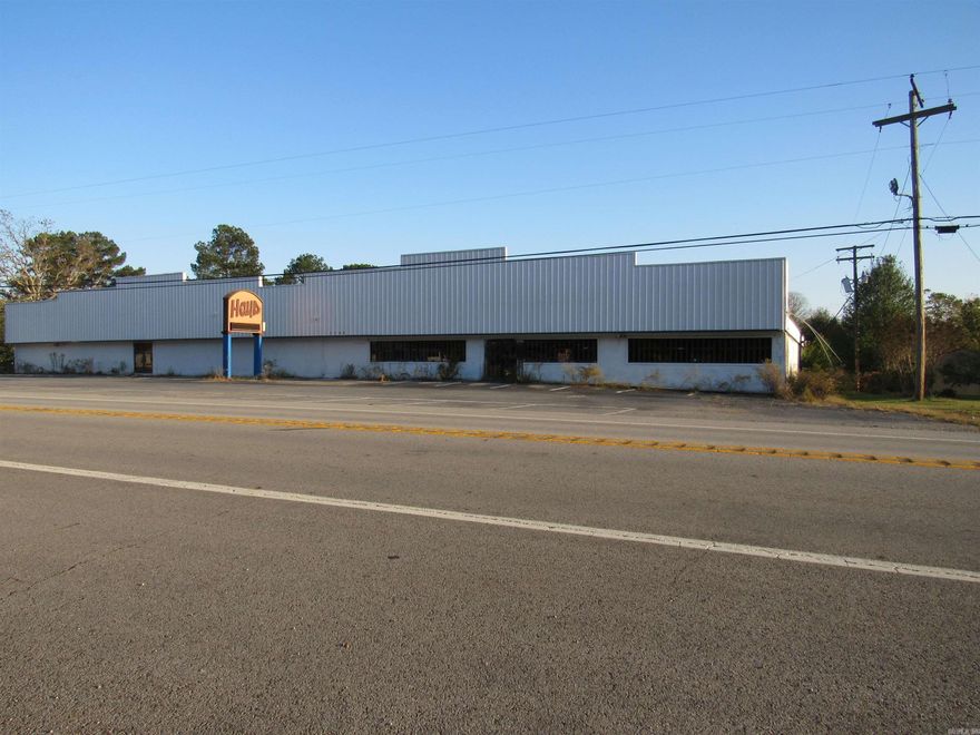 Discover a versatile commercial prospect on nearly two acres! This expansive 23,000 sq ft building offers incredible flexibility for investors or business owners with a vision. Thoughtfully divided into 13,000 sq ft and 10,000 sq ft sections, the layout can be utilized separately for multi-tenant income or easily unified for a single user. Interior features include private offices, three bathrooms, and dressing rooms.  UNLIMITED POTENTIAL USES: Perfect for a large-scale fitness center, retail showroom, light industrial facility, church, creative studios, or co-working space. The generous 2-acre lot provides ample parking and offers immediate income potential for food truck rallies, fleet storage, swap meets, or billboard ground leases.  VALUE-ADD OPPORTUNITY: Building requires revitalization due to past roof leaks (visible damage present). SELLER IS OFFERING UP TO $50,000 CREDIT AT CLOSING FOR ROOF REPLACEMENT! Property is sold AS-IS. A Hold Harmless agreement must be signed prior to entry. Square footage is approximate; buyers are encouraged to measure.