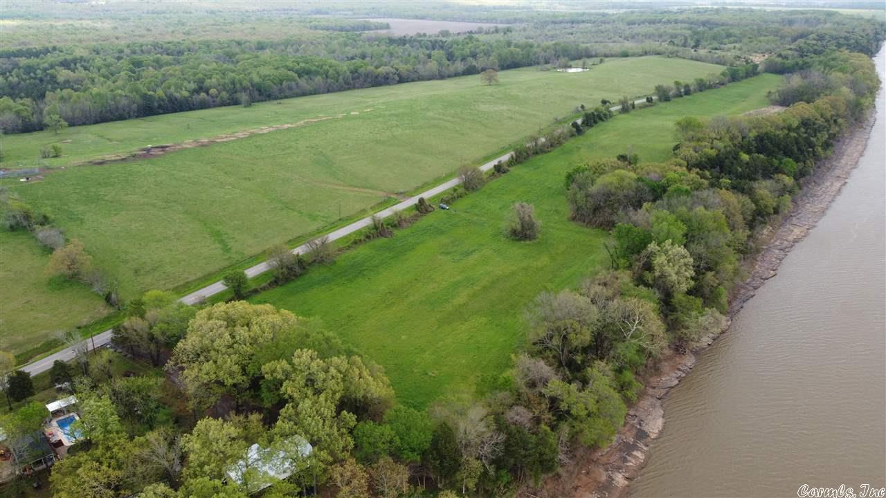 A Developer's Dream! This property is ideal for a row of gorgeous riverfront homes or build your own river home high on the hill with magnificent views of the sunset over Petit Jean Mountain each evening! Selling as part of 5 properties in Atkins, less than one hour from Little Rock! Mineral Rights Convey! The opportunity to purchase approximately 60 adjacent and 400+ nearby acres available.
