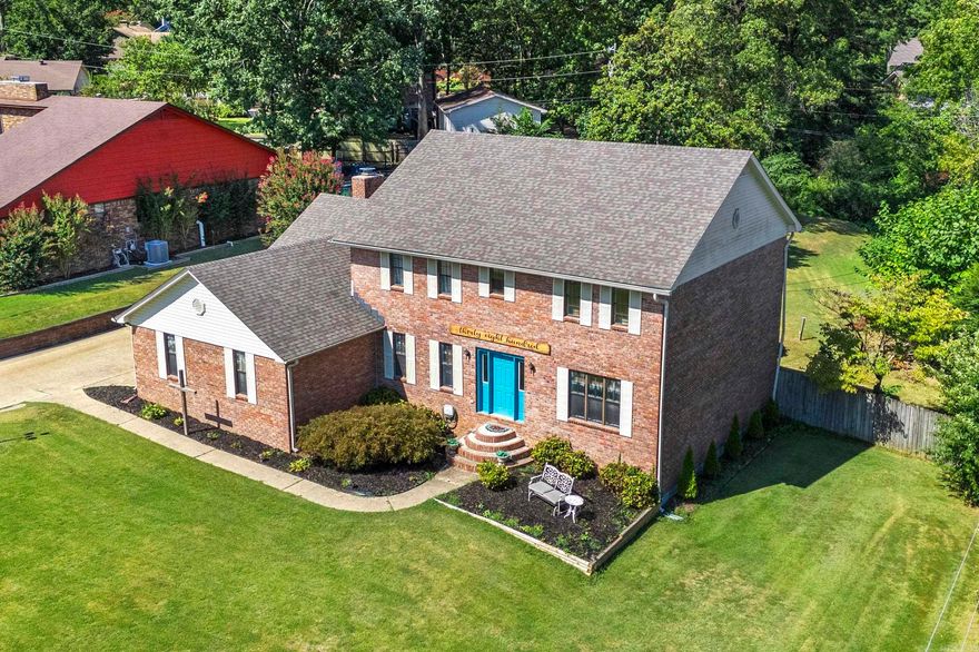 Welcome to this spacious 5-bedroom brick home featuring classic charm and modern updates. Inside, you'll find a warm living room with wood beamed ceilings, a cozy brick fireplace, and built-in shelving that creates a perfect gathering space. The home also includes a closed sunroom, ideal for year-round enjoyment, and a finished basement offering endless possibilities for entertainment or extra living space. Outside, the beautifully maintained yard and striking blue front door add curb appeal, while mature trees provide shade and privacy. This home combines comfort, character, and plenty of room to grow - ready for its next chapter.