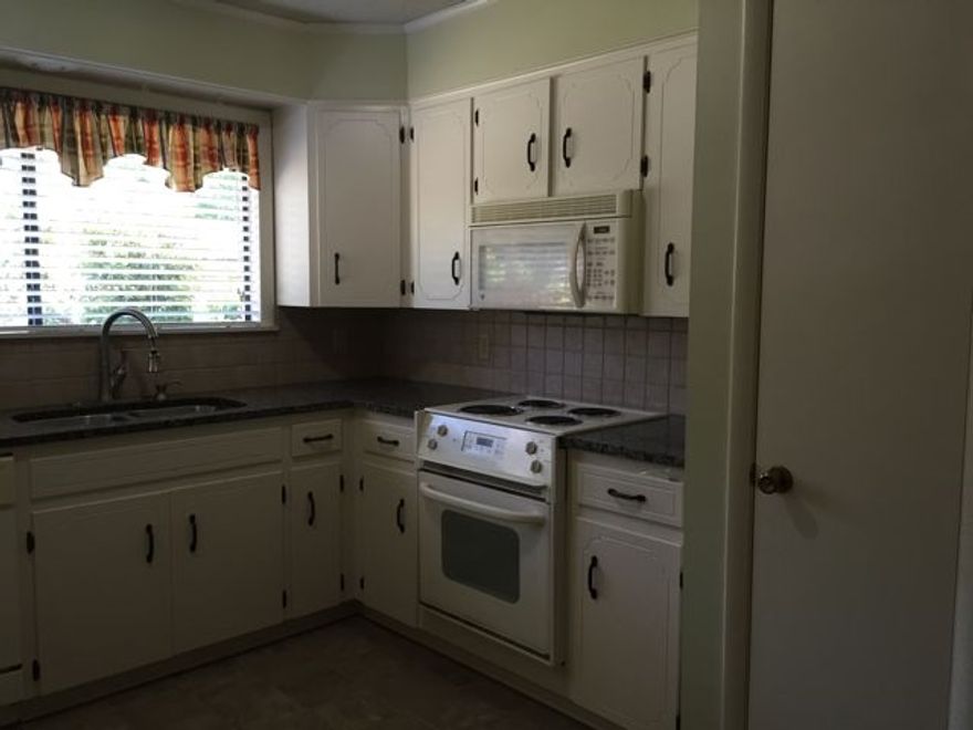 CUTE AND WELL KEPT STARTER HOME OR INVESTMENT PROPERTY. WOOD LAMINATE FLOORING, NO CARPET. KITCHEN AND BATHS HAVE TILE FLOOR. GRANITE COUNTER TOPS. HOME INCLUDES WASHER, DRYER AND REFRIGERATOR. FIREPLACE. BONUS ROOM WITH BATH OFF COVERED BACK PORCH.  THANKS FOR SHOWING!
