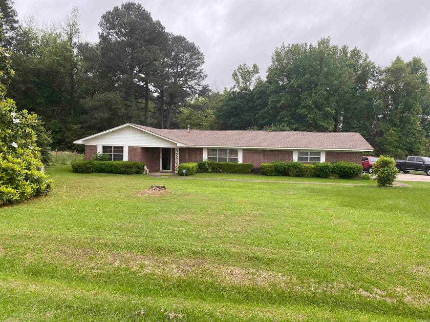 Brick home north of town, situated on approx 1 acres, offers over 1500 sq of living space, 3 bedrooms and 1 1/2 baths.  Newer Roof, New CH/CA unit installed May 2024, two hot water heaters, one gas one electric, 3 car garage with laundry closet and additional storage closet, bonus office and study with access to outside and concrete patio.  This property offers a spacious living room, formal dining room, kitchen with stove, dishwasher and refrigerator to convey at closing, dining area and office. Contact our office for more details or to schedule a private showing.