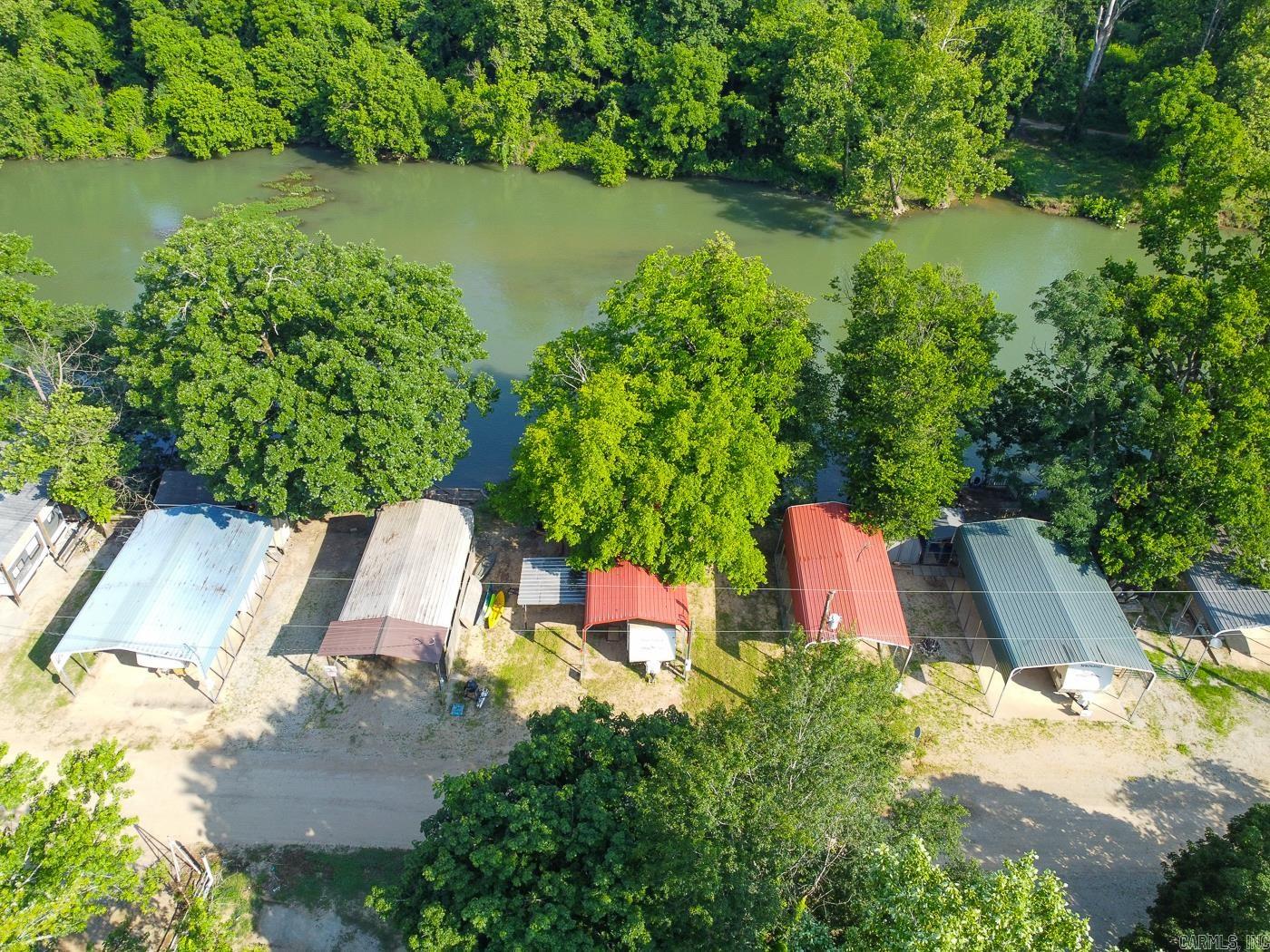 SPRING RIVER FRONTAGE! Welcome to Market, Lot 12, Block 5, in the River Bend Park. This camper lot has steps down to the river, deck, and a metal awning.Ā Annual fee ($900) includes water, sewage pump, trash, power, and access to pools, several bathhouses, and other amenities.Ā Hardy, Arkansas has many nearby attractions including a historic downtown, museums, nature trails, golf courses, and multiple lakes. Located only aĀ little over an hour away from Jonesboro, Mountain Home, or Batesville means this is a perfect location for your next getaway.Ā Call today to make this your new home away from home.