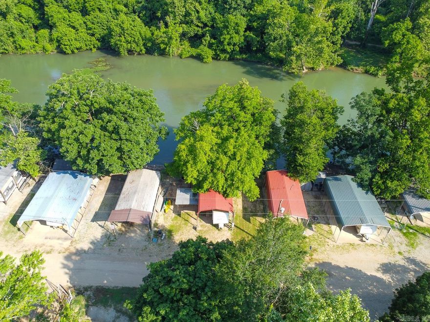 SPRING RIVER FRONTAGE! Welcome to Market, Lot 12, Block 5, in the River Bend Park. This camper lot has steps down to the river, deck, and a metal awning.  Annual fee ($900) includes water, sewage pump, trash, power, and access to pools, several bathhouses, and other amenities.  Hardy, Arkansas has many nearby attractions including a historic downtown, museums, nature trails, golf courses, and multiple lakes. Located only a  little over an hour away from Jonesboro, Mountain Home, or Batesville means this is a perfect location for your next getaway.  Call today to make this your new home away from home.