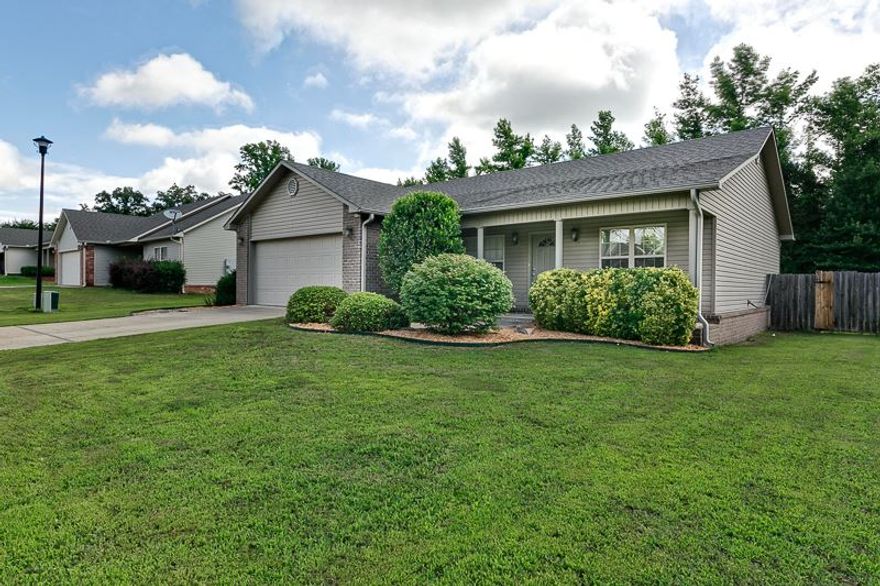 Really nice with SOoo many extras here!!  No carpet...hardwood floors in living area and bedrooms, tile in kitchen, dining, and bathrooms.  Large kitchen with tons of counter space, breakfast bar, stove w/convection oven, new quiet dishwasher w/ss interior, new microwave, pantry with roll outs, & cabinets with roll outs.  Supersized backyard with deck, pergola, and built in grill station.  Backs up to woods too!  FEMA approved storm shelter for 6 to 8 people.  You really have to see this one!