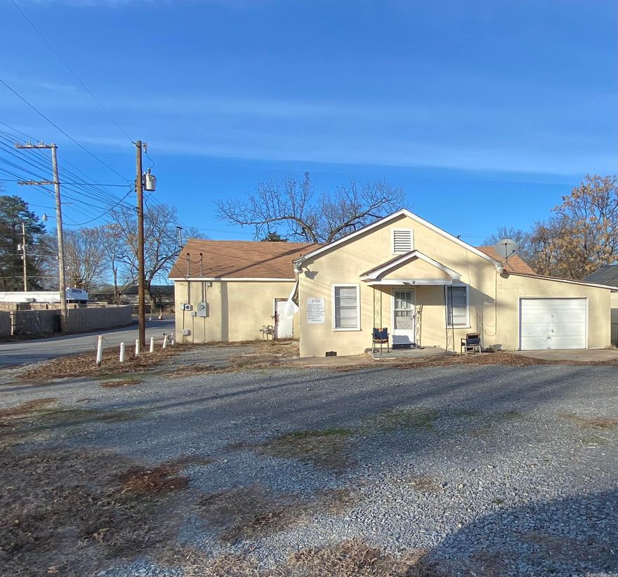 Attention Investors this won't last long! Small living quarters, 672 square feet, and single garage with a huge attached Auto Repair Shop.  The Auto Repair shop is approximately 2084 Square feet.  This can be transformed into other type business space. This property is zoned as C-1. Selling as/is no repairs. Square footage is approximate, measuring is encouraged. Schedule your showing today!