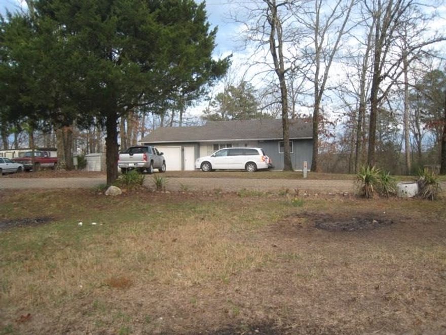 Two level home in quiet cul de sac. Back yard has small grassy area, the rest is nice hardwoods. Open kitchen and dining area, living room, bedroom, bath and laundry upstairs. Downstairs is kitchen, bedroom, bath, utility room and open area used as third bedroom. One car garage. Nice deck off back. Owner is out of state and wants it sold. All offers considered.