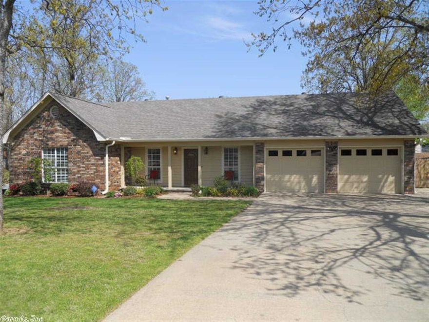 Custom built brick home on large corner lot. New energy efficient double pane windows. New paint throughout. Beautiful  floors throughout home. Wood burning fireplace with gas starter. Oversized double car garage. Energy efficient exterior walls (6 in.). Nice kitchen with beautiful cabinets and tile floor. Roof is less than 2 years old. Large backyard for gardening or playing with children.