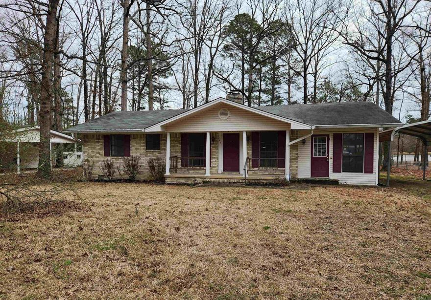 Looking for Lake Front? Take a look at this home! Lake front with a dock, this home is like the perfect little get-a-way! Large covered back deck, fishing dock, 1 car carport and more. Sold as is. Agents read confidential remarks.