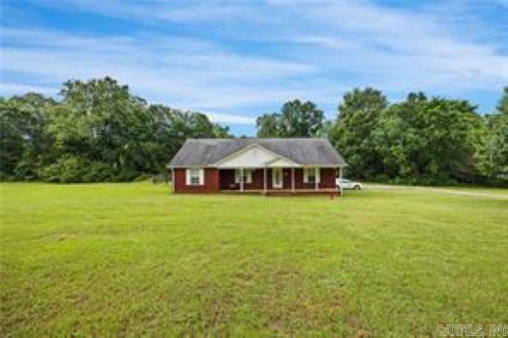 Beautiful country home on 4.4 acres located just minutes from town. This home features a spacious open floor plan that makes for comfortable living. Oversized laundry room with space for exercise equipment/hobby area or simply more storage. And don't forget the like new inground swimming pool with covered back porch and large patio area. Perfect for entertaining or just relaxing at the end of the day. Additional metal building is perfect for a shop area, tools, ATV, mowers etc.