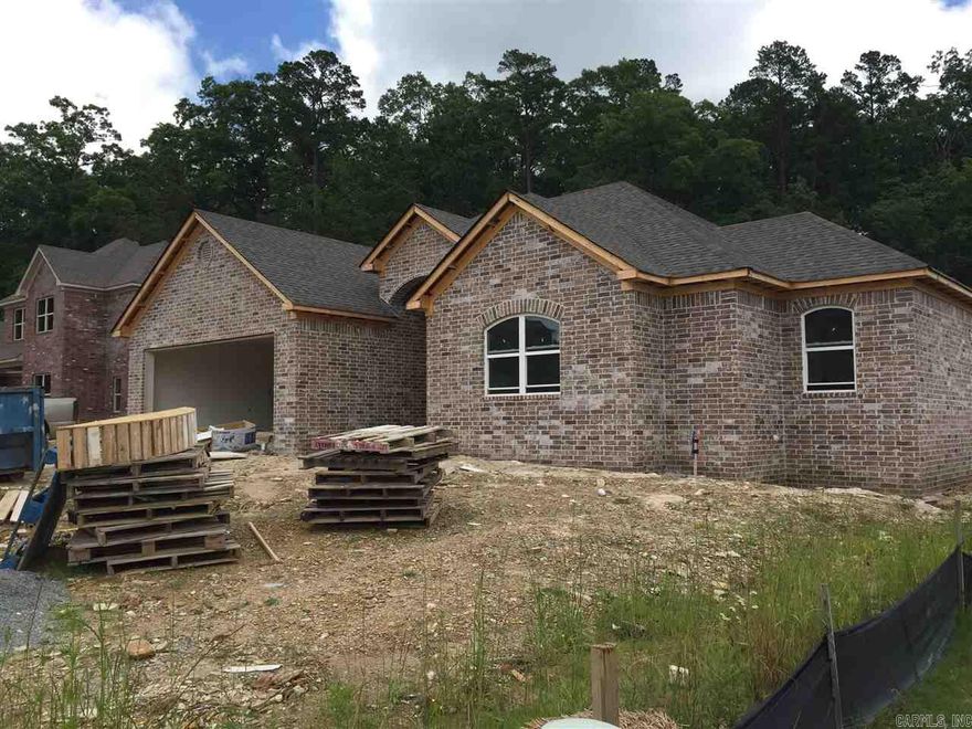 100% all brick Jody Petty home. 3 bedroom 2 full baths. Hand scraped laminate floors in all main areas, carpet in bedrooms, tile in wet areas (excluding kitchen). Custom White cabinets, Carrara tops through out. Custom walk in tile shower in master. 7'x7' storage room accessible through garage.