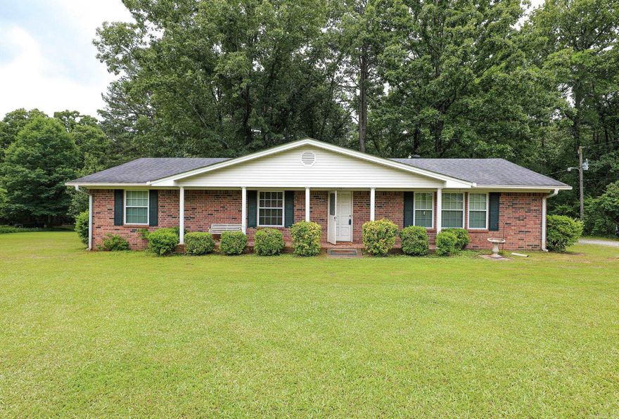 This one owner all brick home offers you all you need in your forever estate! Super neat and clean sturdy older home, acreage to play on, a shop, shed, huge front yard and shaded woods in the back! Three bedrooms and two baths with an open kitchen, large dining, large living room with lots of windows! Spacious laundry with extra closets and room for a frig or freezer. Outside features are the 30x 50 metal shop with heat, a storage shed and boat shed. Front yard is open and lush and the back acreage is wooded. Something for everyone. On a dead end road so little traffic and a great country living feel!  A Really well kept home and grounds that you will fall in love with!